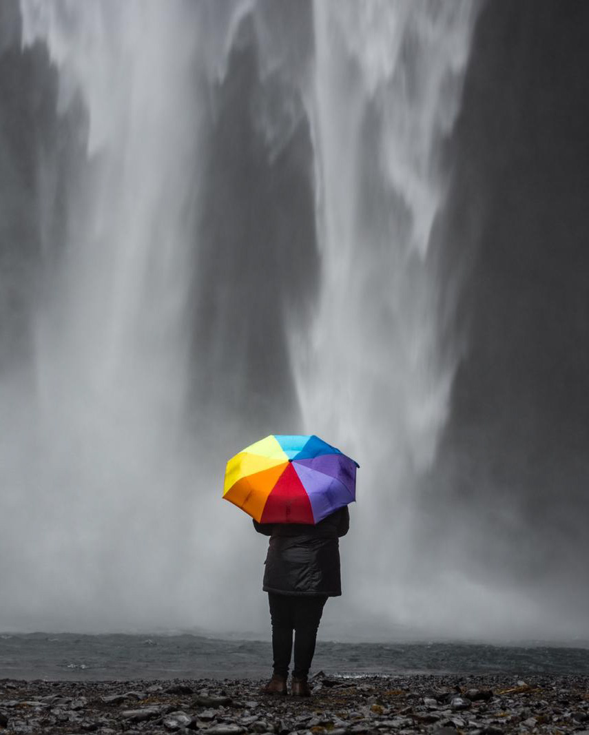  A photo of Regan stood in front of Skogafoss, Iceland (2019) © Brett Kowalski